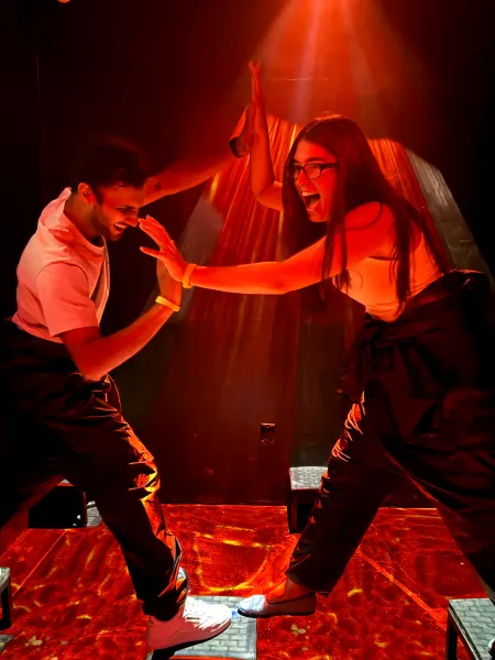 Two people playing floor is lava