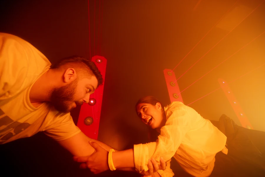 Masked people in a laser room