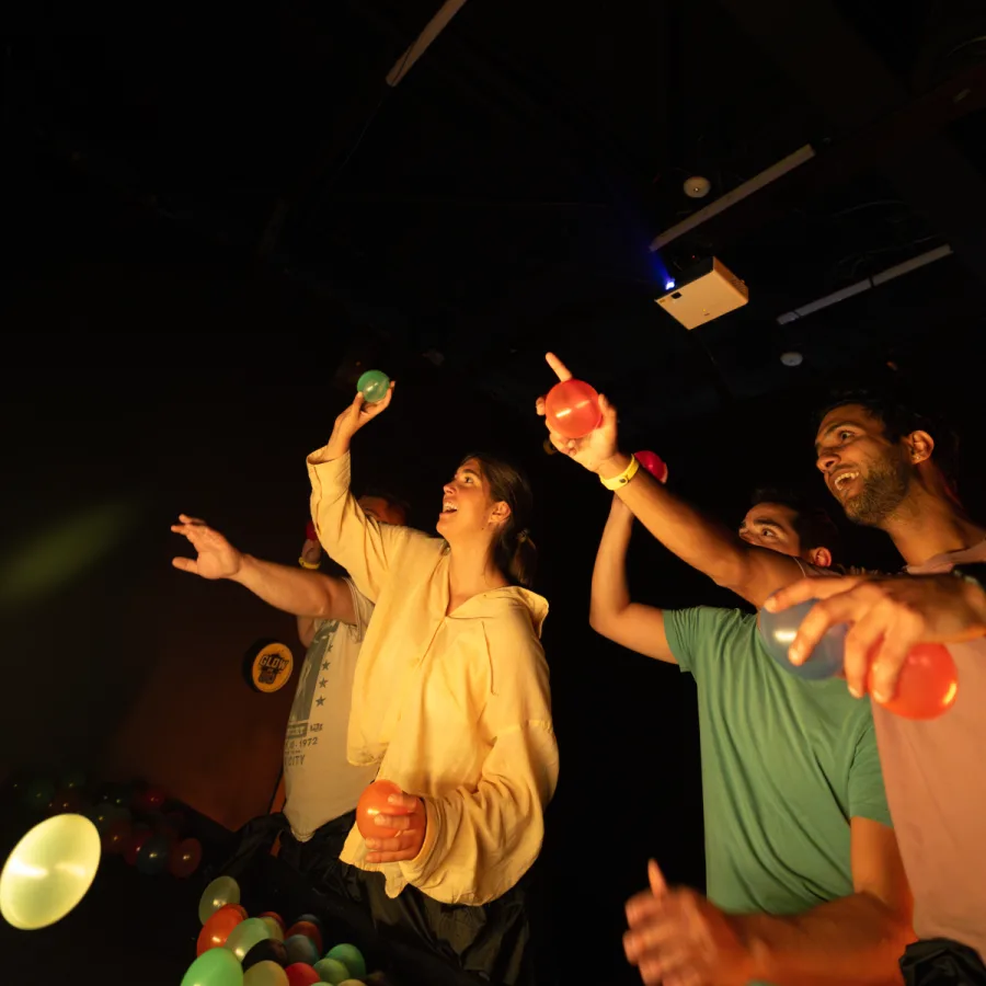 People in a room jumping and having fun