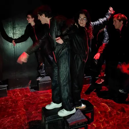 A boy and a girl playing The Floor is Lava above two platforms